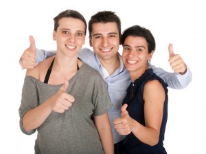 Brother and sisters showing thumbs up